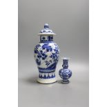 A Chinese blue and white vase and cover, Kangxi mark, 19th century, 26.5cm tall, and a Chinese