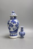 A Chinese blue and white vase and cover, Kangxi mark, 19th century, 26.5cm tall, and a Chinese