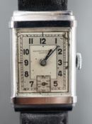 A gentleman's steel Record Watch Co, manual wind wrist watch, on associated leather strap.