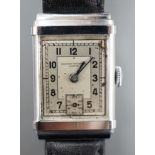 A gentleman's steel Record Watch Co, manual wind wrist watch, on associated leather strap.