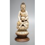 A 19th century Chinese ivory seated figure of Buddha Shakyamuni - 19cm tall