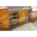 A 1920's mahogany bowfont bookcase, width 152cm, depth 39cm, height 116cm