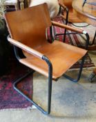 A set of four contemporary tan leather cantilver dining chairs, width 56cm depth 50cm height 79cm