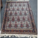 A Persian blue ground rug decorated with Zil-i-Soltan motifs on ivory fields, 106 x 152cm