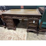 An early 20th century oak kneehole desk, length 122cm, depth 66cm, height 75cm