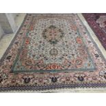 A Tabriz ivory ground carpet, 425 x 306cm