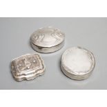 Three assorted continental white metal pill boxes including Dutch with filigree panel and German,