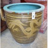 A circular Chinese style glazed earthenware garden planter, diameter 50cm height 50cm.