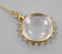 An early 20th century 15ct mounted eye glass pendant, 29mm, on a yellow metal fine link chain, gross