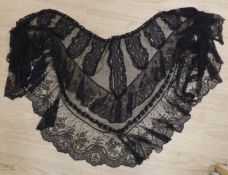 A black lace Chantilly handmade bertha