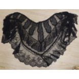 A black lace Chantilly handmade bertha