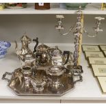 A French plated Cristofle tea set, together with other plated tea wares and a candelabrum