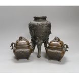 A pair of Japanese bronze censers and covers and a Japanese bronze tripod censer, 23cm tall, (3)