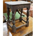 An oak joint stool (wormed), width 45cm, depth 27cm, height 52cm