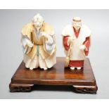 Two Japanese stained ivory figures of court servants, Taisho/early Showa period, signed - tallest