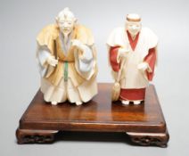 Two Japanese stained ivory figures of court servants, Taisho/early Showa period, signed - tallest