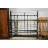 A Victorian style iron and brass double bed frame, width 136cm