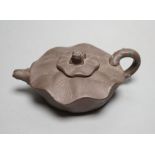 A Yixing clay teapot.