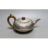 A George IV fluted silver teapot, Emes & Barnard, London, 1825, gross 13.5 oz.