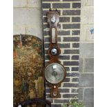 A Regency strung mahogany wheel barometer by J. Spelzini, Holborn, height 109cm