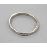 A white metal (stamped platinum) wedding band, size K,1.8 grams.