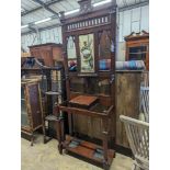 A late Victorian walnut hallstand, length 75cm, depth 30cm, height 203cm