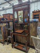 A late Victorian walnut hallstand, length 75cm, depth 30cm, height 203cm