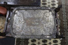 A large two handled silver plated tray with ornate floral edge,87 cms wide.