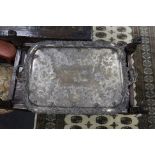 A large two handled silver plated tray with ornate floral edge,87 cms wide.