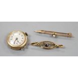 Two early 20th century 9ct and gem set bar brooches and a lady's 9ct manual wind wrist watch, no