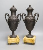 A pair of bronzed spelter urns on marbled base - 40cm tall