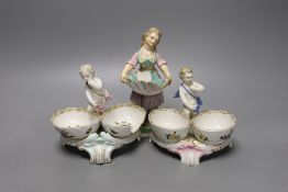 Two 19th century German porcelain putti salts and a Sampson Hancock, Derby figurine holding a