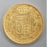 A Victorian 1861 gold young head shield back sovereign, London Mint (1 over lower 1).