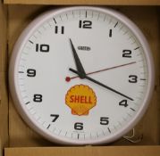 A Smith's 'Shell' advertising wall clock,32 cms diameter.