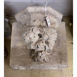 A carved simulated limestone corbel, width 42cm, height 35cm