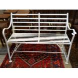 A white painted wrought iron garden bench, length 122cm, depth 48cm, height 90cm