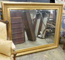 A large reproduction Victorian style gilt framed wall mirror, width 150cm, height 124cm