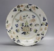 An English polychrome delftware charger,33cms diameter.