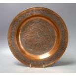 A copper and silver Islamic-style inlaid dish - 32cm diameter