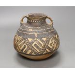 A Chinese neolithic pottery two handled jar - 14cm tallProvenance: the vendor‘s parents lived in