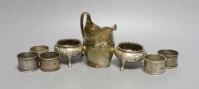 A George III silver cream jug, London, 1806, 10.6cm, a pair of Victorian silver bun salts and four