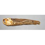 A Japanese ivory 'dried fish' netsuke, 19th century, 10cm long