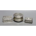 A modern silver mounted trinket box,82mm and two late Victorian embossed silver small boxes.
