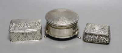 A modern silver mounted trinket box,82mm and two late Victorian embossed silver small boxes.