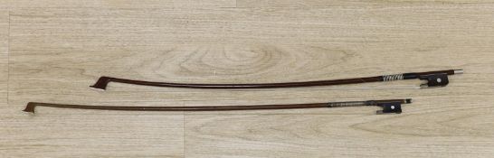 Two violin bows, signed Erich Steiner and Tourte,73 cms long.