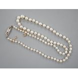A single strand graduated cultured pearl choker necklace, with diamond chip set 18ct & plat,