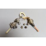 A George V silver, bone and mother of pearl mounted child's rattle, 16.1cm and a similar rattle with