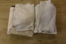 Twelve French provincial coarse linen night shirts.
