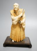 A Japanese ivory figure of a Samurai general, Taisho/early Showa period, signed to a lacquer