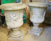 A pair of reconstituted stone campana garden urns, height 52cm